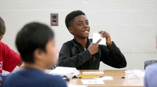 Child pointing to object
