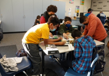 Students in the FSTI K-12 program working on a project.